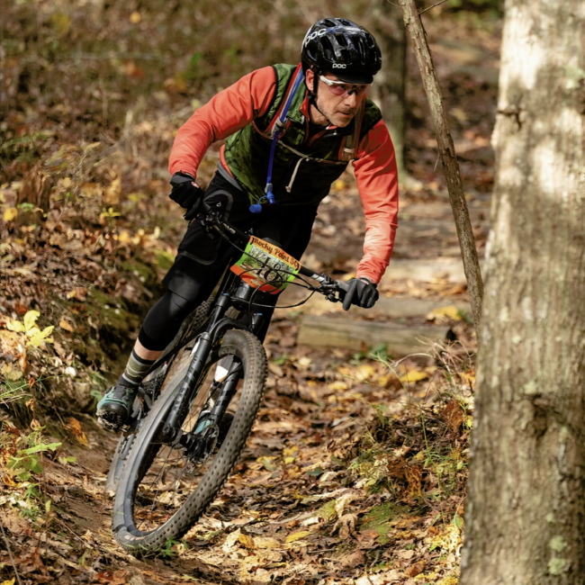 Dr. Lubarsky Cycling through the woods.